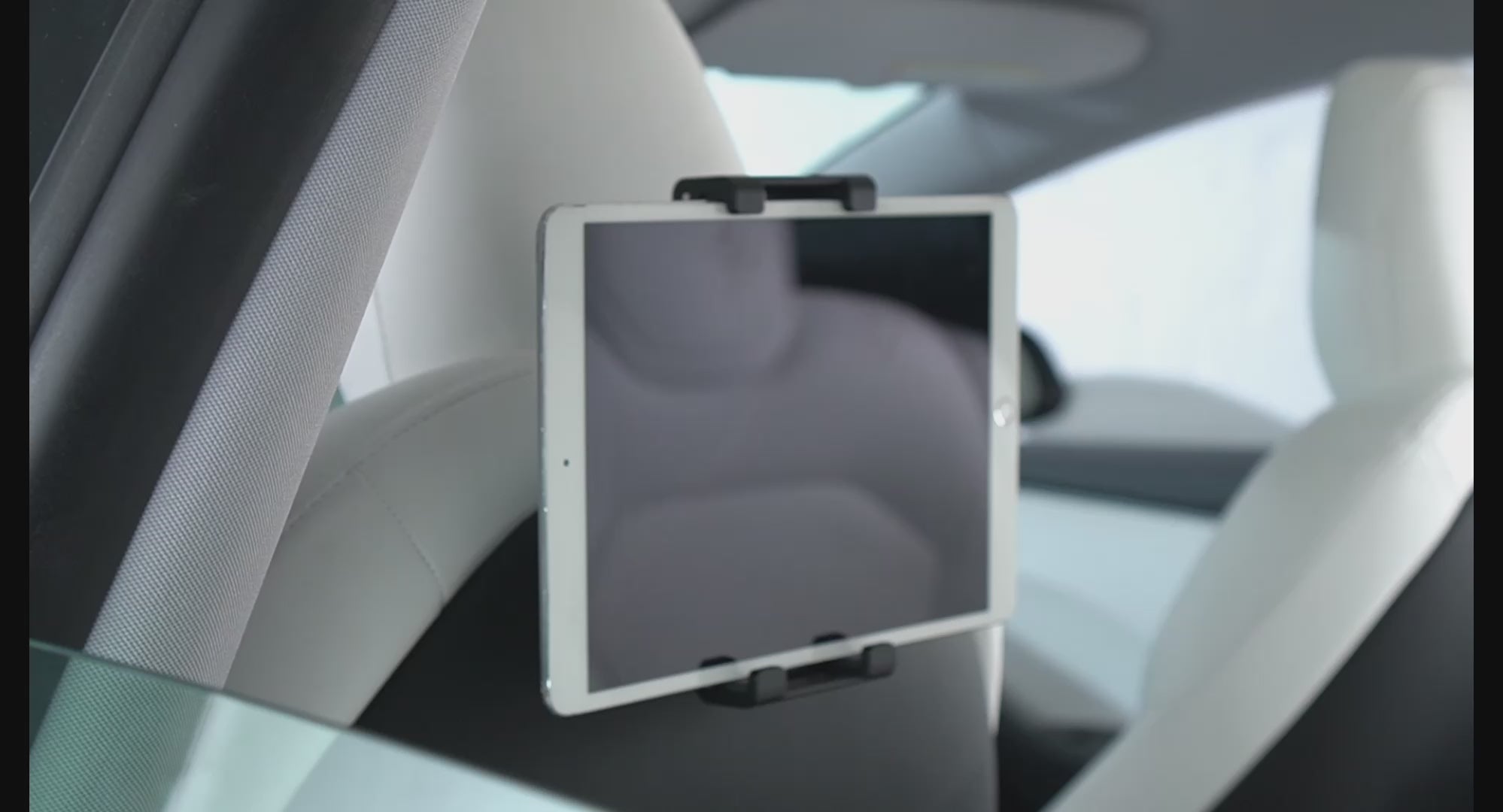 Load video: Tparts Back Seat Tablet / Phone Holder For Model 3/Y